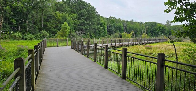 view of property's community with a forest view