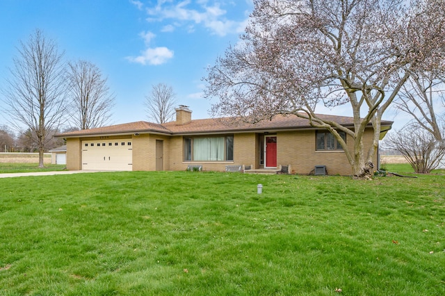 3529 E Lemon Creek Rd, Berrien Springs, MI 49103 - single story home featuring an attached garage, brick siding, a front yard, concrete driveway, and a chimney