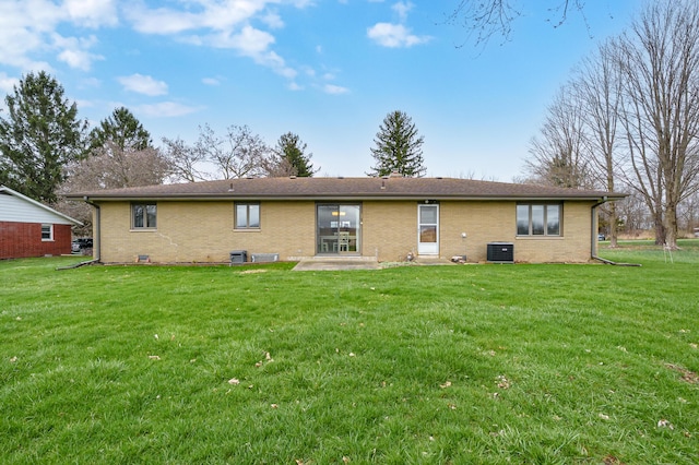 3529 E Lemon Creek Rd, Berrien Springs, MI 49103 - back of property featuring central air condition unit, brick siding, a yard, and a patio area