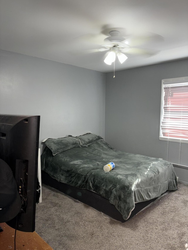 carpeted bedroom with a ceiling fan