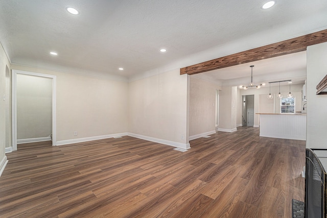 unfurnished living room featuring recessed lighting, baseboards, a chandelier, and dark wood-type flooring