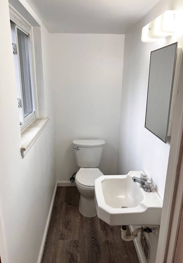 25954 Salem Unit 5, Roseville, MI 48066 - half bathroom with a sink, baseboards, toilet, and wood finished floors