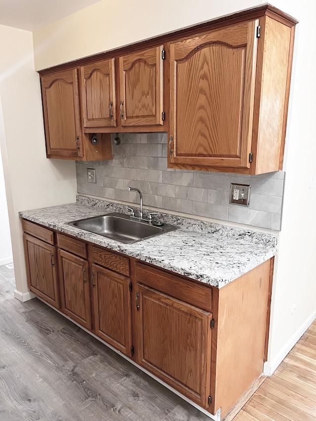 25954 Salem Unit 5, Roseville, MI 48066 - kitchen with a sink, baseboards, and light wood finished floors