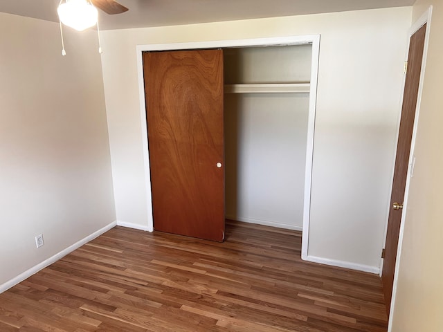 25954 Salem Unit 5, Roseville, MI 48066 - unfurnished bedroom featuring baseboards, ceiling fan, wood finished floors, and a closet