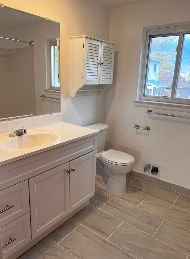 25954 Salem Unit 5, Roseville, MI 48066 - bathroom with toilet, visible vents, plenty of natural light, and vanity