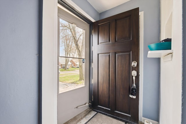 interior space featuring baseboards