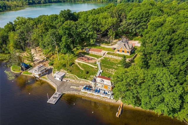 drone / aerial view with a water view and a wooded view
