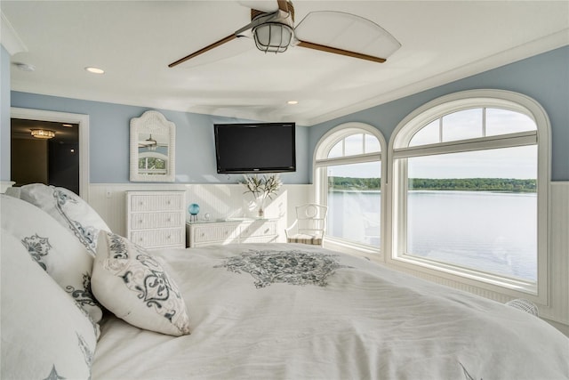 bedroom featuring a ceiling fan, wainscoting, and recessed lighting