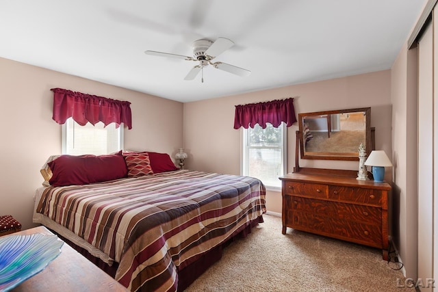 carpeted bedroom with ceiling fan