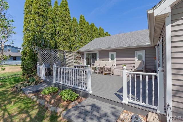 wooden deck featuring outdoor dining area