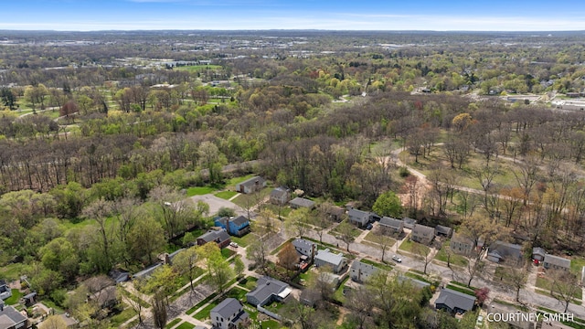 bird's eye view with a residential view and a wooded view