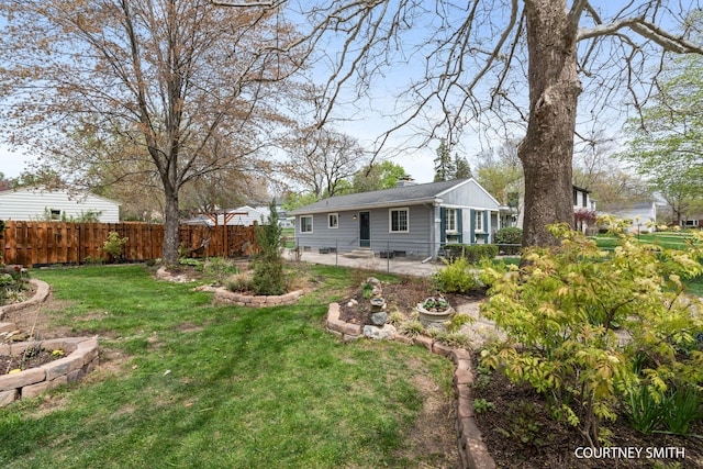 view of yard with a patio and a fenced backyard