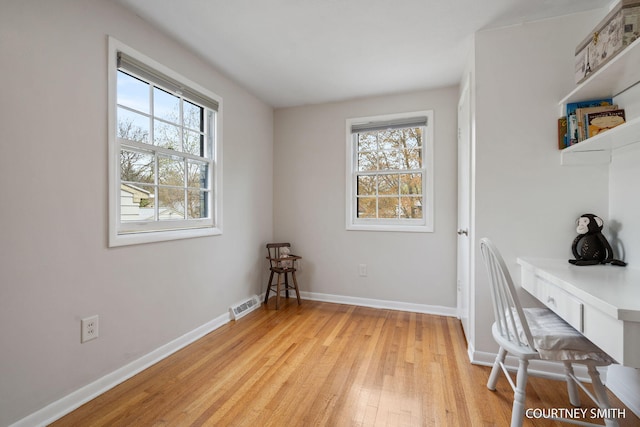 office with visible vents, light wood finished floors, and baseboards