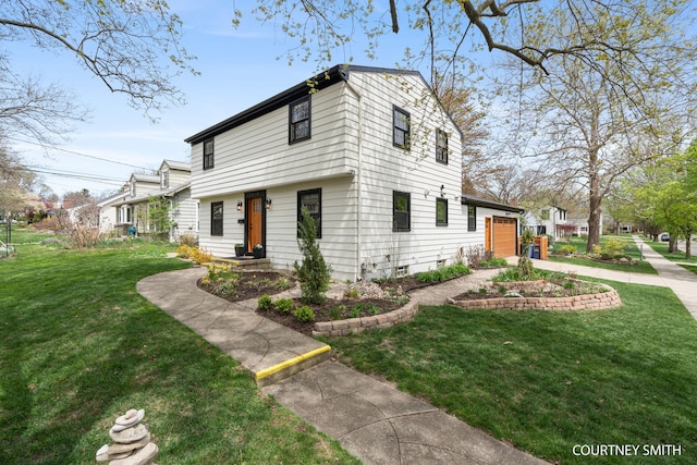 view of front of property featuring concrete driveway and a front yard