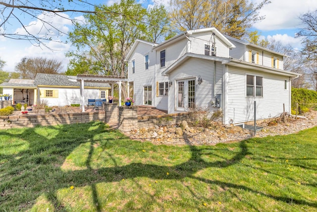 back of property with a pergola, a yard, and a patio