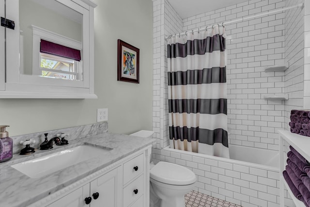 bathroom featuring vanity, tile patterned floors, shower / bath combo, and toilet