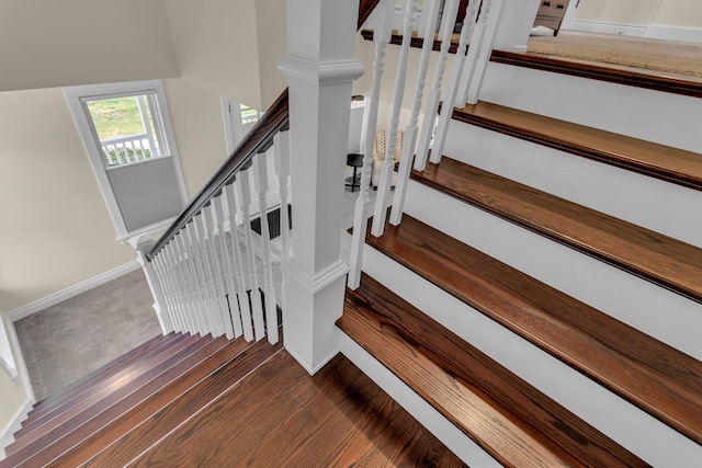 staircase featuring wood finished floors