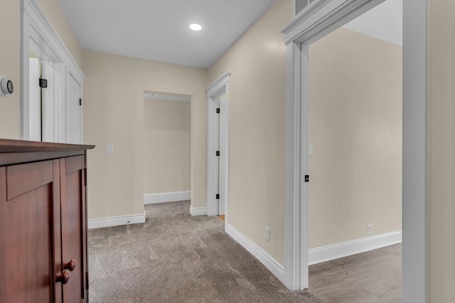 corridor with recessed lighting, baseboards, and carpet floors