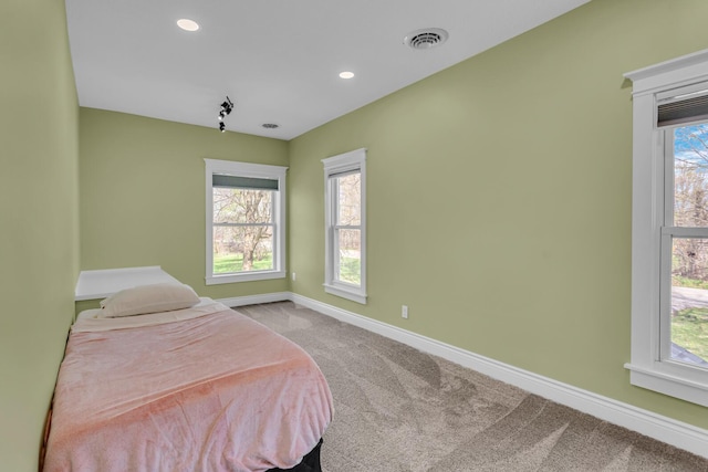 bedroom with carpet flooring, recessed lighting, baseboards, and visible vents