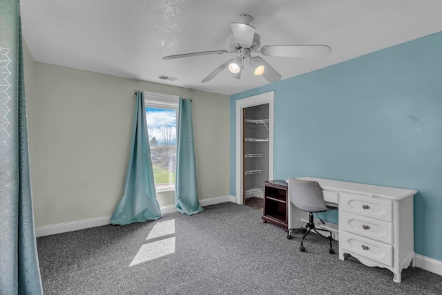 home office with carpet floors, a ceiling fan, baseboards, and visible vents