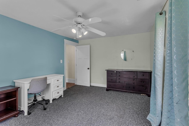 office space featuring dark colored carpet and a ceiling fan