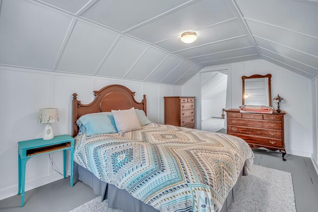 bedroom featuring lofted ceiling