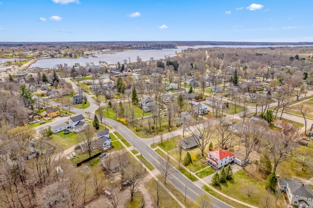 bird's eye view with a residential view and a water view