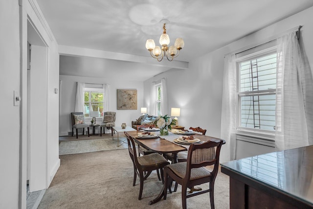 1319 Rhodes St, Jackson, MI 49202 - dining area with carpet flooring and a chandelier