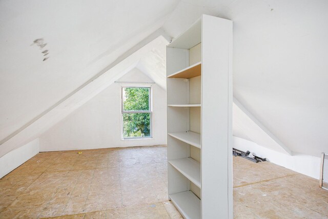 bonus room featuring vaulted ceiling