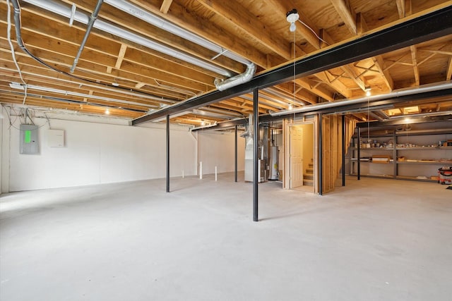 unfinished below grade area with electric panel and heating unit