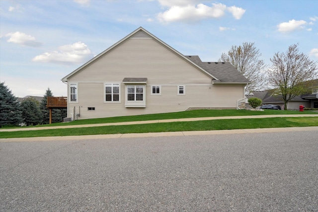 view of home's exterior with a lawn