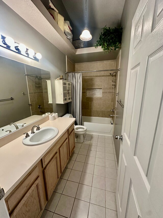 full bathroom featuring toilet, shower / tub combo with curtain, tile patterned flooring, and vanity