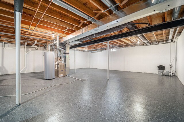 unfinished below grade area with gas water heater and heating unit