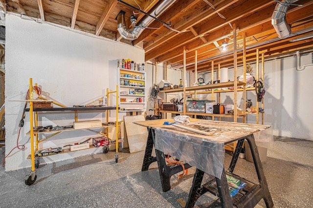 unfinished below grade area with a workshop area