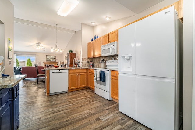 kitchen featuring dark wood-style flooring, white appliances, a sink, a peninsula, and vaulted ceiling