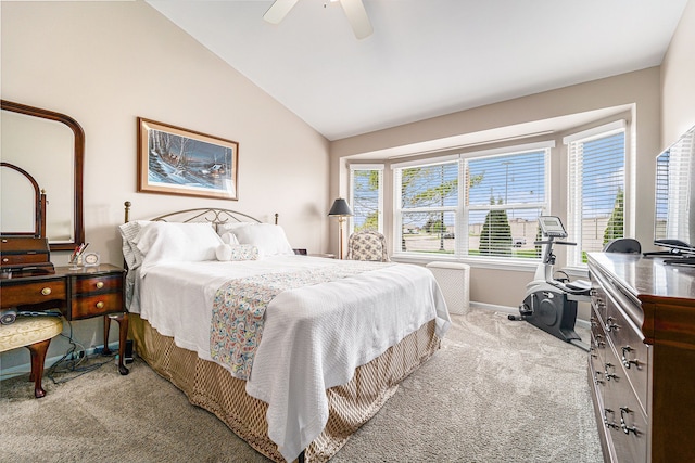 bedroom featuring baseboards, a ceiling fan, carpet floors, and vaulted ceiling