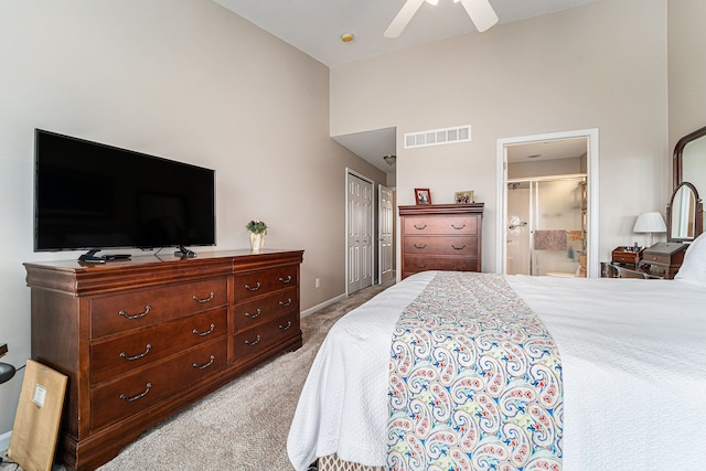 bedroom featuring a ceiling fan, visible vents, connected bathroom, high vaulted ceiling, and light colored carpet
