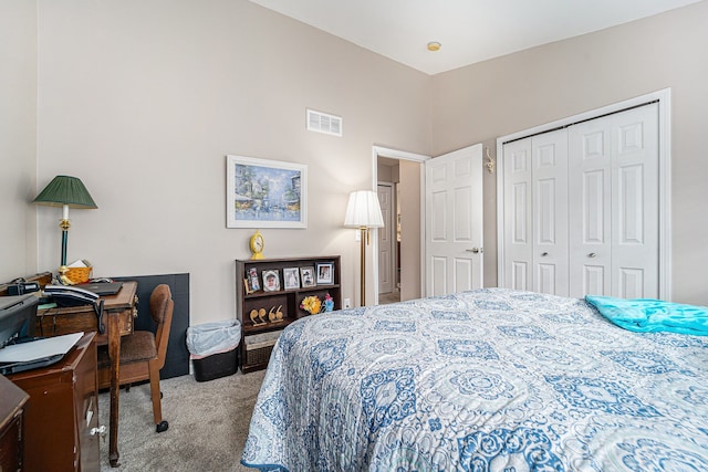 bedroom with carpet flooring, a closet, and visible vents