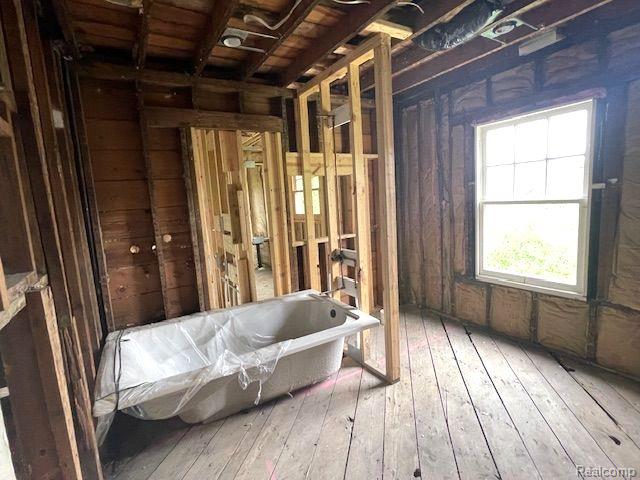 1485 Longfellow St, Detroit, MI 48206 - full bath featuring a soaking tub and hardwood / wood-style flooring