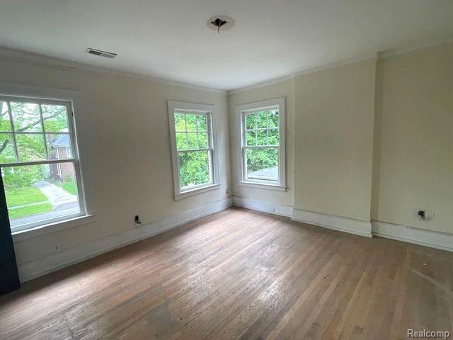 1485 Longfellow St, Detroit, MI 48206 - spare room featuring ornamental molding, wood finished floors, and baseboards