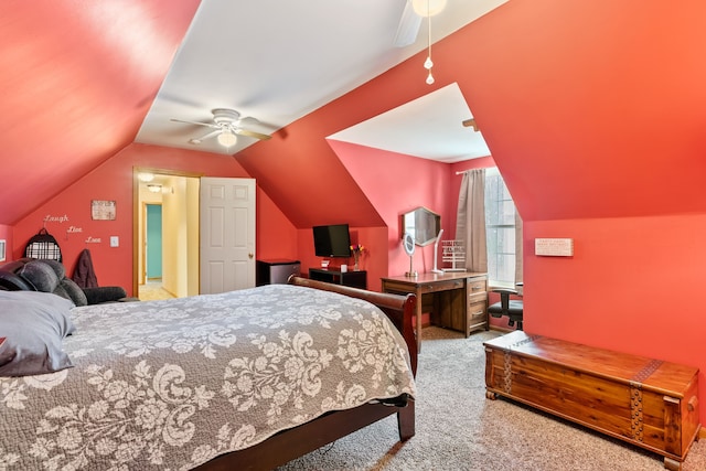 carpeted bedroom with ceiling fan and vaulted ceiling