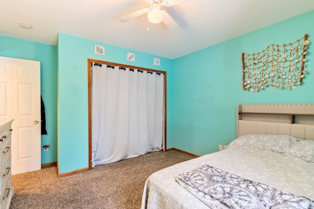 carpeted bedroom with baseboards, a ceiling fan, and a closet
