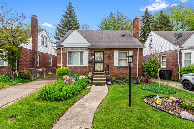 11718 Wayburn St, Detroit, MI 48224 - bungalow-style house featuring brick siding, a gate, and a chimney