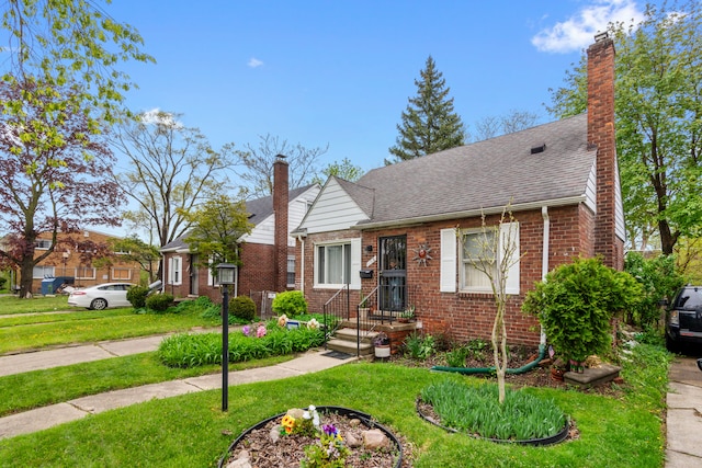 11718 Wayburn St, Detroit, MI 48224 - bungalow-style home with a chimney, brick siding, a front lawn, and roof with shingles