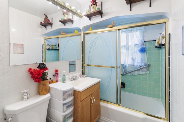 11718 Wayburn St, Detroit, MI 48224 - full bath featuring tile walls, vanity, toilet, shower / bath combination with glass door, and backsplash