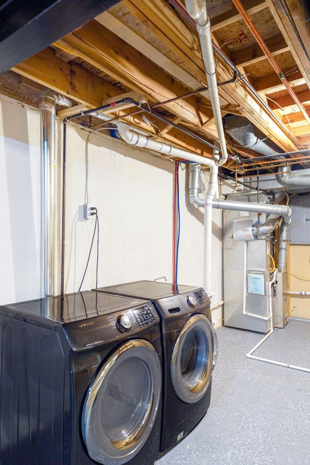 clothes washing area featuring laundry area and washing machine and dryer