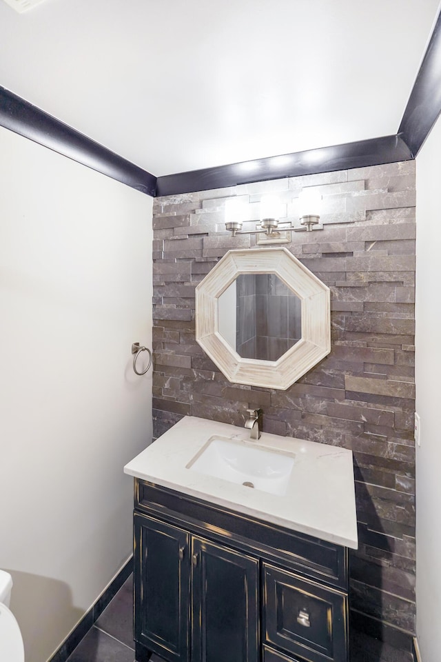 bathroom with vanity, tasteful backsplash, and tile patterned floors