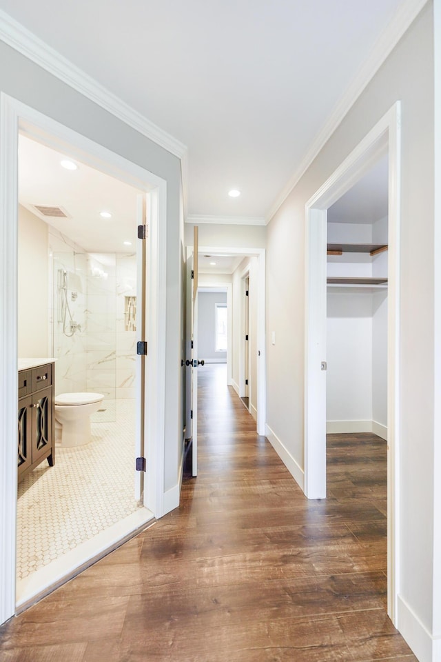 hallway featuring recessed lighting, baseboards, dark wood finished floors, and visible vents
