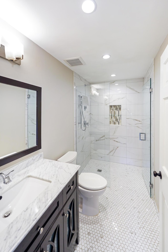 full bathroom featuring vanity, toilet, recessed lighting, a shower stall, and visible vents