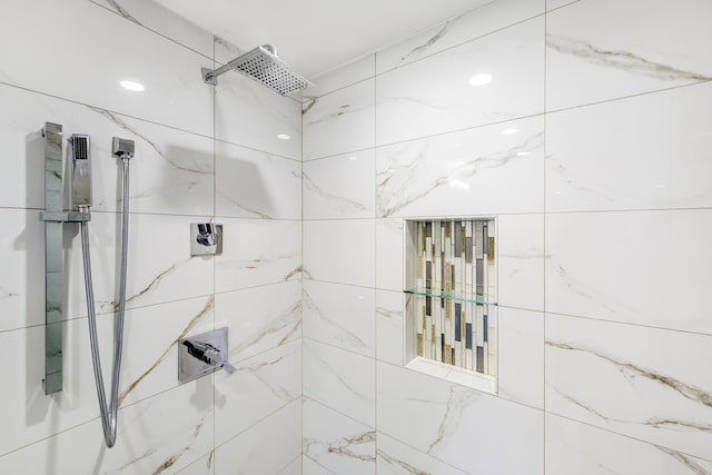 bathroom with tiled shower